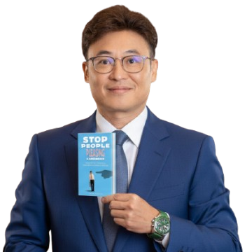 Dhennver Ng holding Stop People Pleasing Handbook